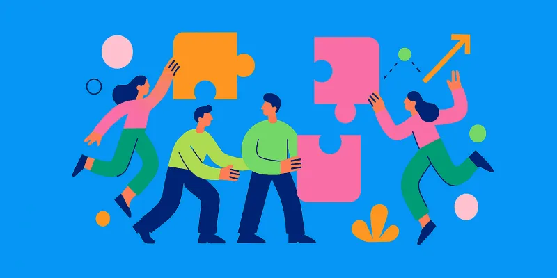 Team collaboration with puzzle pieces.